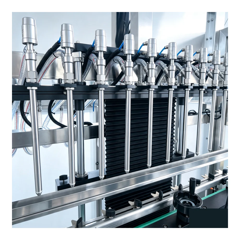 Close-up of 10 filling heads for peanut oil bottling