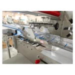 Film feeding and forming area of top film flow wrapper