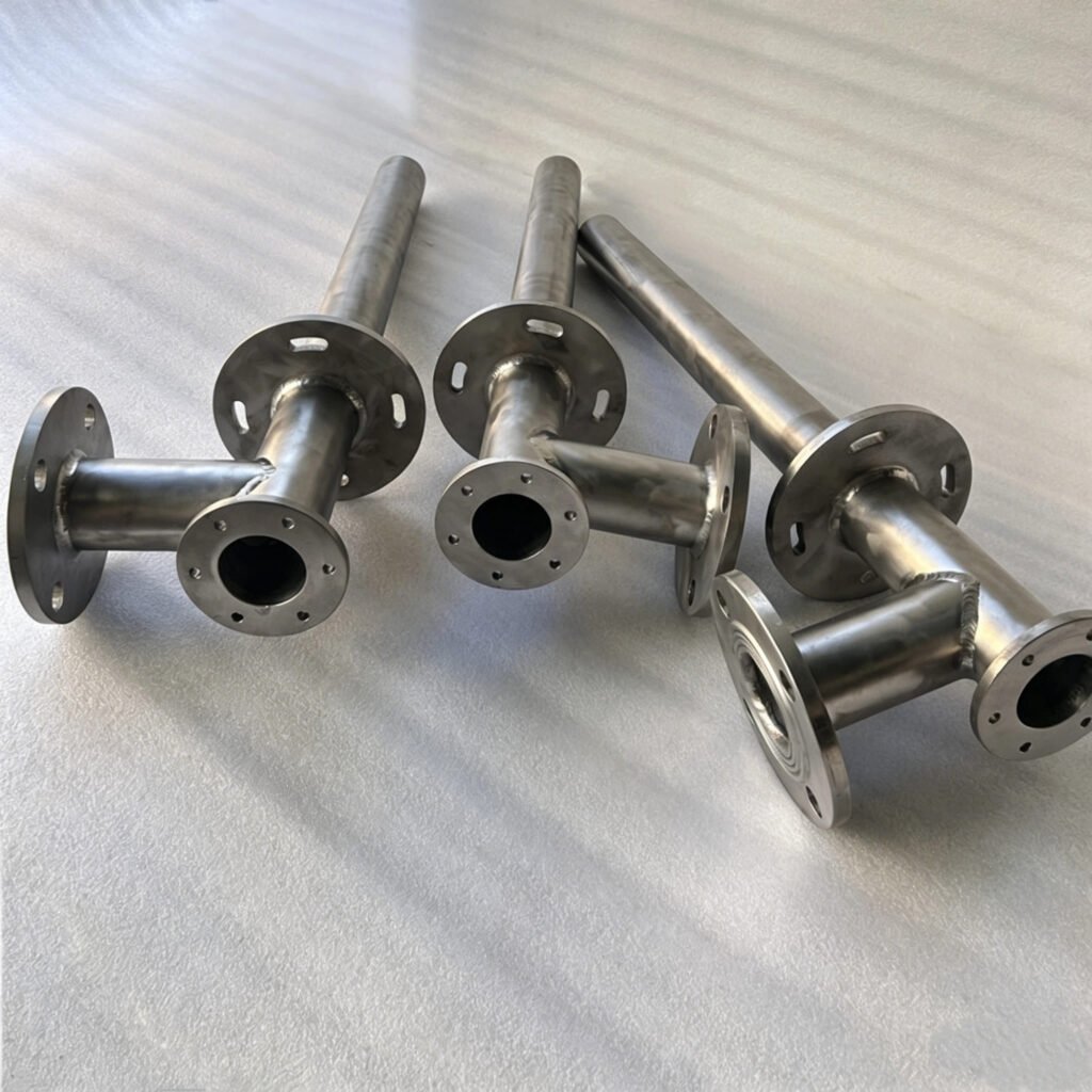 Custom fabricated titanium pipe spool with tee and flanges